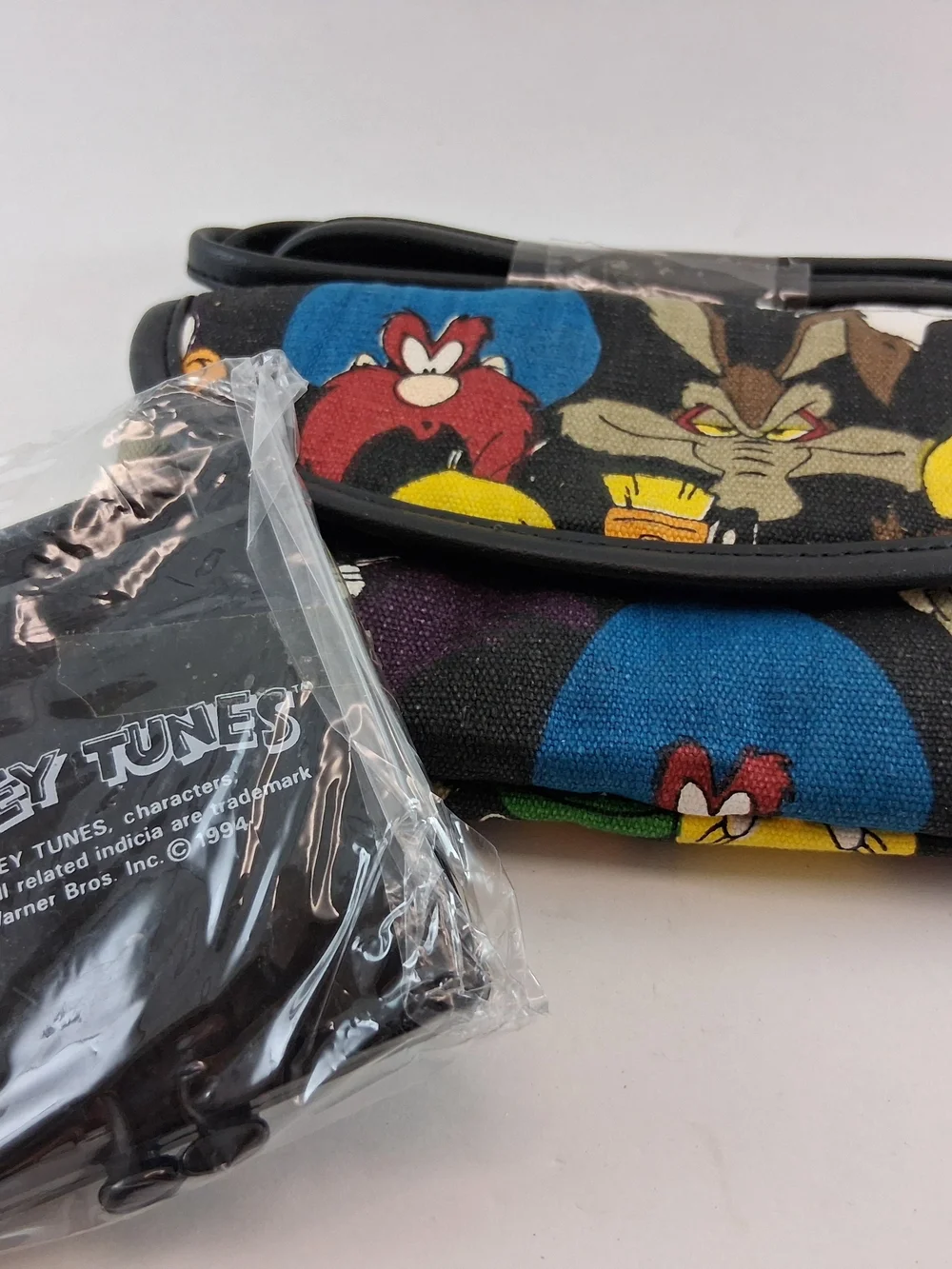 Vtg. Warner Bros. Black Crossbody with Colorful Looney Tunes Faces
